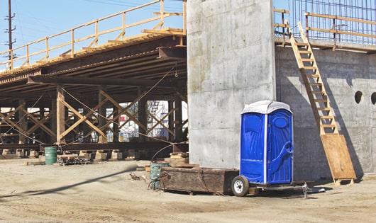 work site necessities a group of portable toilets ready for use by the crew